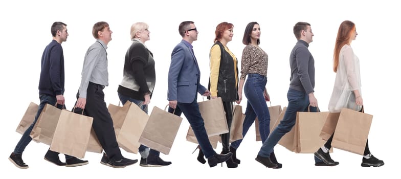 a group of people stand in line with shopping bags. isolated on white