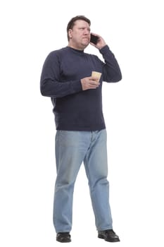 casual mature man with smartphone and takeaway coffee .isolated on a white background.