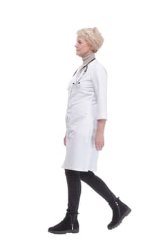 responsible female doctor with a stethoscope striding forward. isolated on a white background.