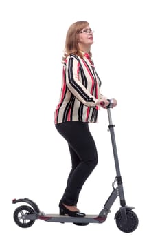 side view. modern casual woman with an electric scooter. isolated on a white background