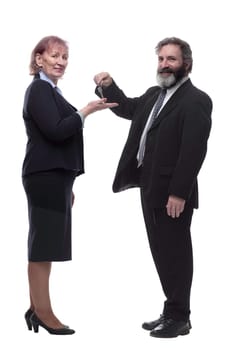 in full growth. businessman handing keys to a business lady . isolated on a white background