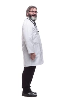 side view. senior male doctor looking at you. isolated on a white background