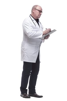 in full growth. a serious doctor writing a prescription. isolated on a white background