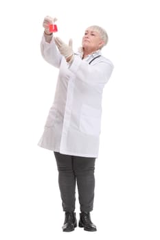 Front view of mature scientist or doctor are testing bloods to prevent and destroy new strains of the virus through tube and beaker. Successful concept