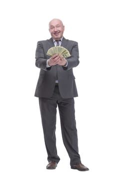 in full growth. smiling business man with dollar bills.isolated on a white background.
