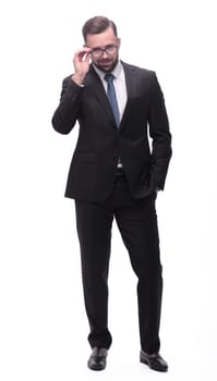 full length . a successful young man in a business suit. isolated on white background