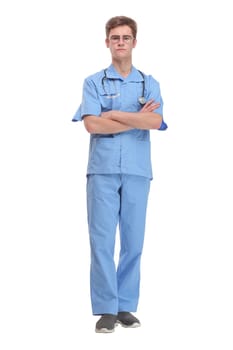 Surgeon wearing blue uniform with stethoscope standing with folded arms isolated on white