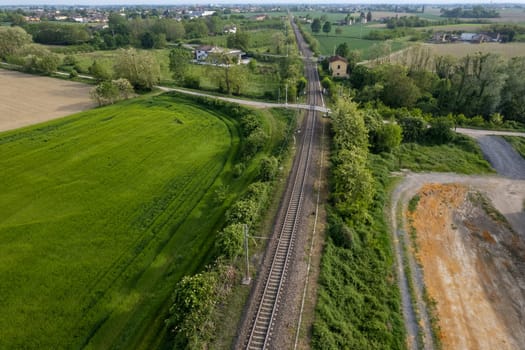 Flying over railway tracks, top view. Railway track tracks line railroad train rail aerial photo panoramic view travel