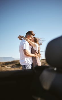 Road trip, travel and couple kiss and hug for holiday, vacation or outdoor adventure with blue sky mock up advertising or marketing. Love, romantic people with car by countryside road summer mockup.