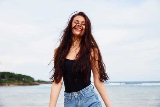 woman walking sun beach copy sexy travel running hair smile happy sea wave summer person young smiling happiness space sunset beauty lifestyle