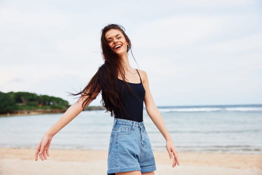 woman wave running smile water sunset happiness positive beach lifestyle sea fun tan sunrise walking carefree beautiful young travel hair summer