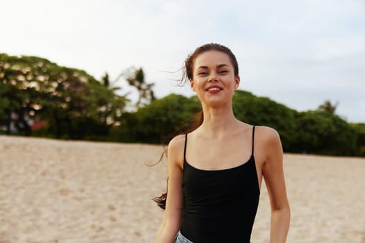 woman happiness sea ocean enjoyment sunset holiday beauty happy peaceful summer caucasian copy-space beach sand water smile sun lifestyle vacation beautiful