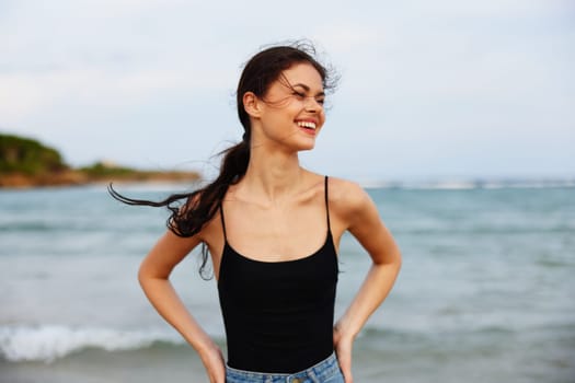 vacation woman young holiday shore hair leisure beach sea sunset running sand smile lifestyle ocean summer tropical smiling long beautiful sun happy