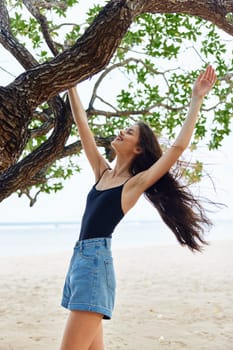 happiness woman yoga nature smiling sand sky tree beautiful lifestyle horizon model young leisure vacation relax ocean hanging beauty sea sunny