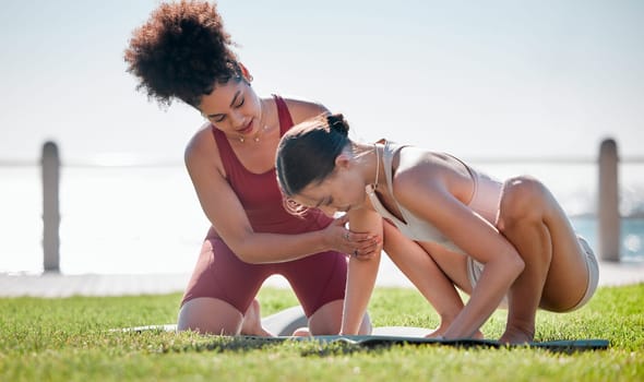 Yoga class, personal trainer or women support, helping and learning balance, training and exercise on beach or park. Coaching black woman with pilates workout on grass for sports and body wellness.