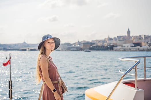 Portrait of beautiful woman tourist with view of Galata tower in Beyoglu, Istanbul, Turkey. Turkiye.