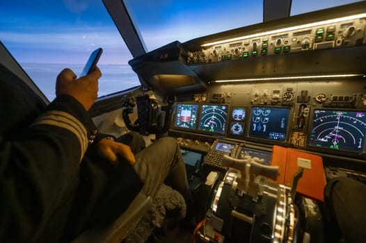 The pilot uses a smartphone while flying the plane. Autopilot