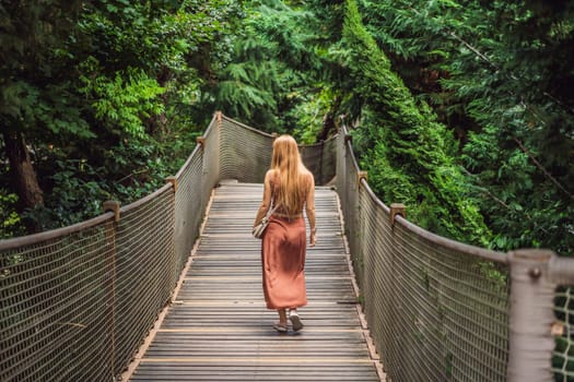 Woman tourist in Rope bridge in Yildiz Park. Besiktas, Istanbul, Turkey. Turkiye.