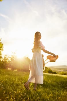 a woman in a light dress walks in nature holding a hat in her hands lit from the back by the sun. High quality photo