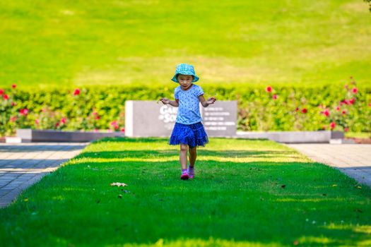 Little girl having a good time in the garden