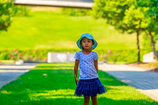 Little girl having a good time in the garden