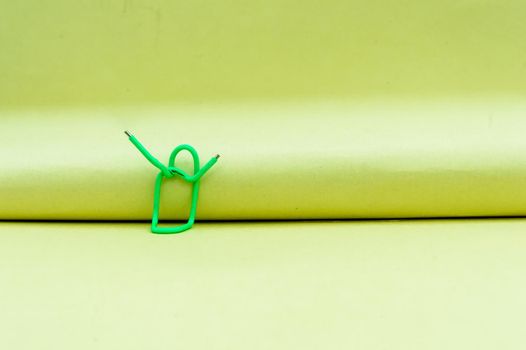 Hands in the air. Abstract Human Figure of Paper Clip. Creative Photography. Still life. Copy Space