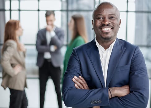 Handsome african american executive businessman in the office close up