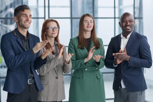 Now thats a standing ovation. Shot of a group of businesspeople applauding during a seminar in the conference room.