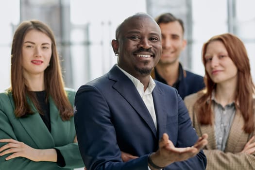 a team of businessmen stand in the lobby of a modern office