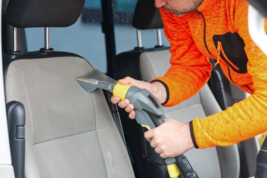 car dry cleaning. Light gray textile seats chemical cleaning with professionally extraction method. regular clean up