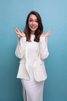 happy incendiary brunette young woman in white dress won the beauty contest.