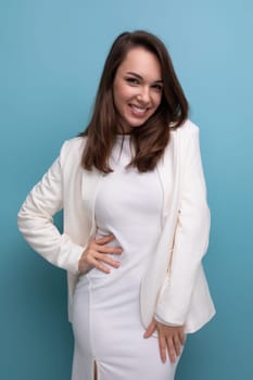 portrait of a well-groomed caucasian brunette woman in a white dress.