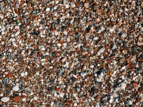 Excellent natural concept for interior exterior decoration or any design. Wet sea pebbles or rocks, stones as nature background. Beautiful sea stones of different sizes, colors and texture.