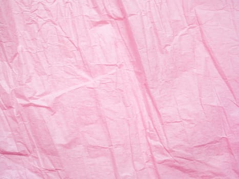 Wrinkled texture of sheet Pink crumpled paper texture background. Macro shot of wrapping paper. Creased sheet backdrop. Textured effect of page. Abstract pattern, pink backdrop surface.