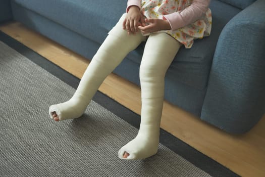 little child boy with plaster bandage on leg