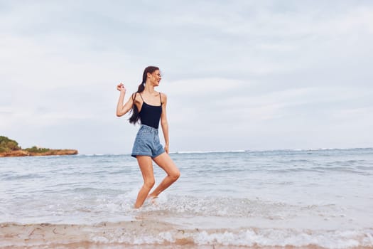 walking woman lifestyle wave sand travel running happy sunset active body person positive beauty tan young summer smile sea fun beach