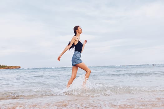 woman smile sunset female smiling body sea wave beach travel summer relax fun young nature activity lifestyle sexy running sunrise walking