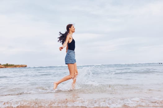 woman shore water smile sexy running summer positive happy fun hair beautiful young smiling long sunset female travel sea hair beach lifestyle