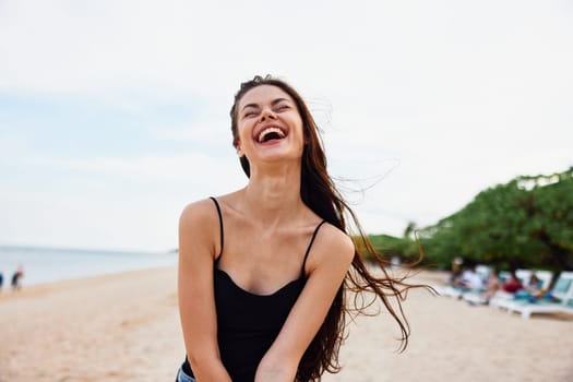 female woman travel vacation bag caucasian smiling young leisure sea ocean summer beauty beautiful nature sand lifestyle beach copy-space smile sunset