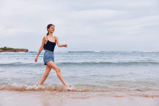 woman beach ocean hair girl positive copy travel sea young summer sun wave freedom flight running fun sunset space smile lifestyle leisure