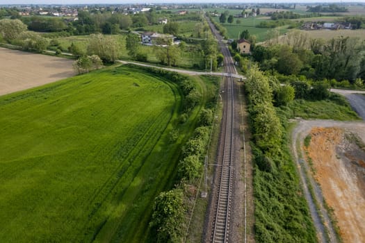 Flying over railway tracks, top view. Railway track tracks line railroad train rail aerial photo panoramic view travel