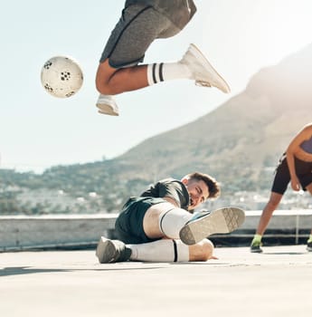 Ball, soccer and rooftop game with men sports training activity together fitness workout in city. Diversity, football competition and friends lifestyle exercise for health and wellness outdoors.