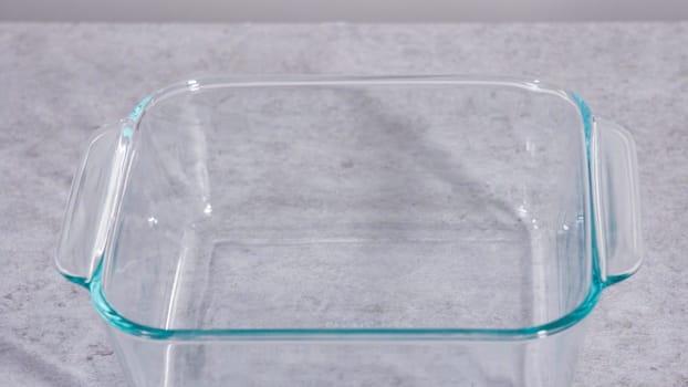 Empty square glass baking dish on the kitchen counter.
