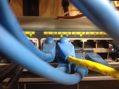 Blue Cables Going to Network Switch, IT Data Wires. High quality photo