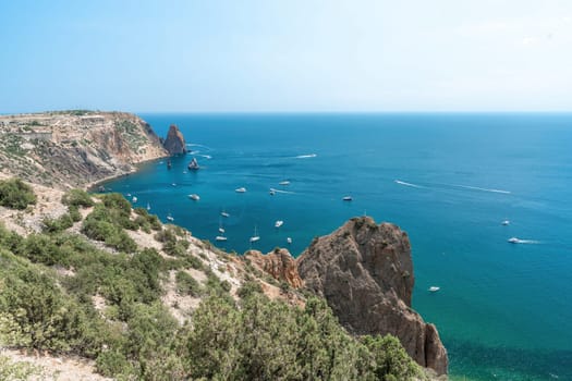 Aerial panoramic view of beautiful sunset above sea. Beautiful seascape. Sun glare, small waves on the water surface. Evening. Horizon. Nobody. No people. Copy space. Never-ending beauty of nature