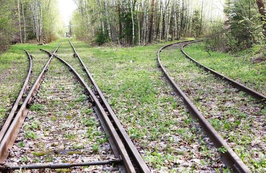 An abandoned old railway in the middle of the forest