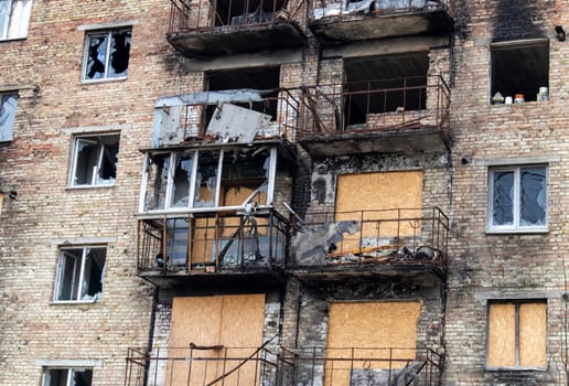 Burnt apartments in a multi-storey residential building, the consequences of the war in Ukraine. Buildings damaged by shells. Real creepy footage of the war in Ukraine. The rest of the property