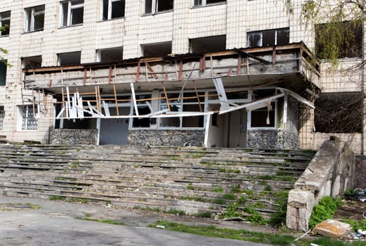 Burnt apartments in a multi-storey residential building, the consequences of the war in Ukraine. Buildings damaged by shells. Real creepy footage of the war in Ukraine. Remains of property