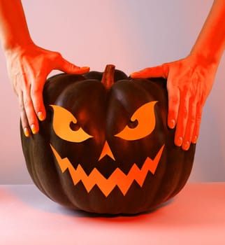 Halloween Pumpkin with Paper Cut Scary Face on a White Background. Jack Halloween. Smile Jack Pumpkin. Copy space