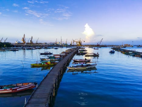 Aerial top down on traditional colourful asian fisherman boats moored in Gresik, Indonesia. Drone Photography. Aerial Photography.